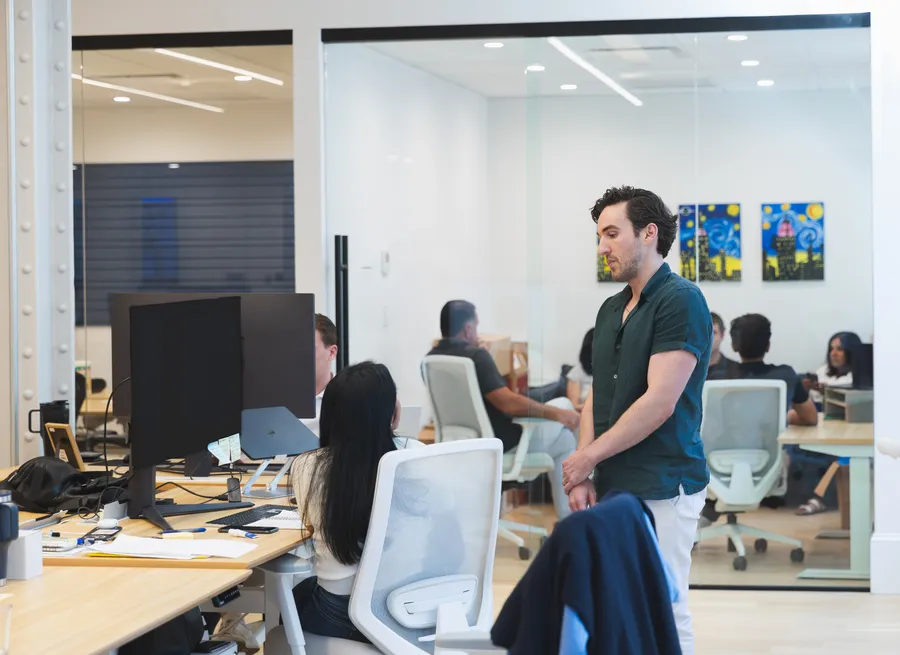 Team discussion in a glass meeting room